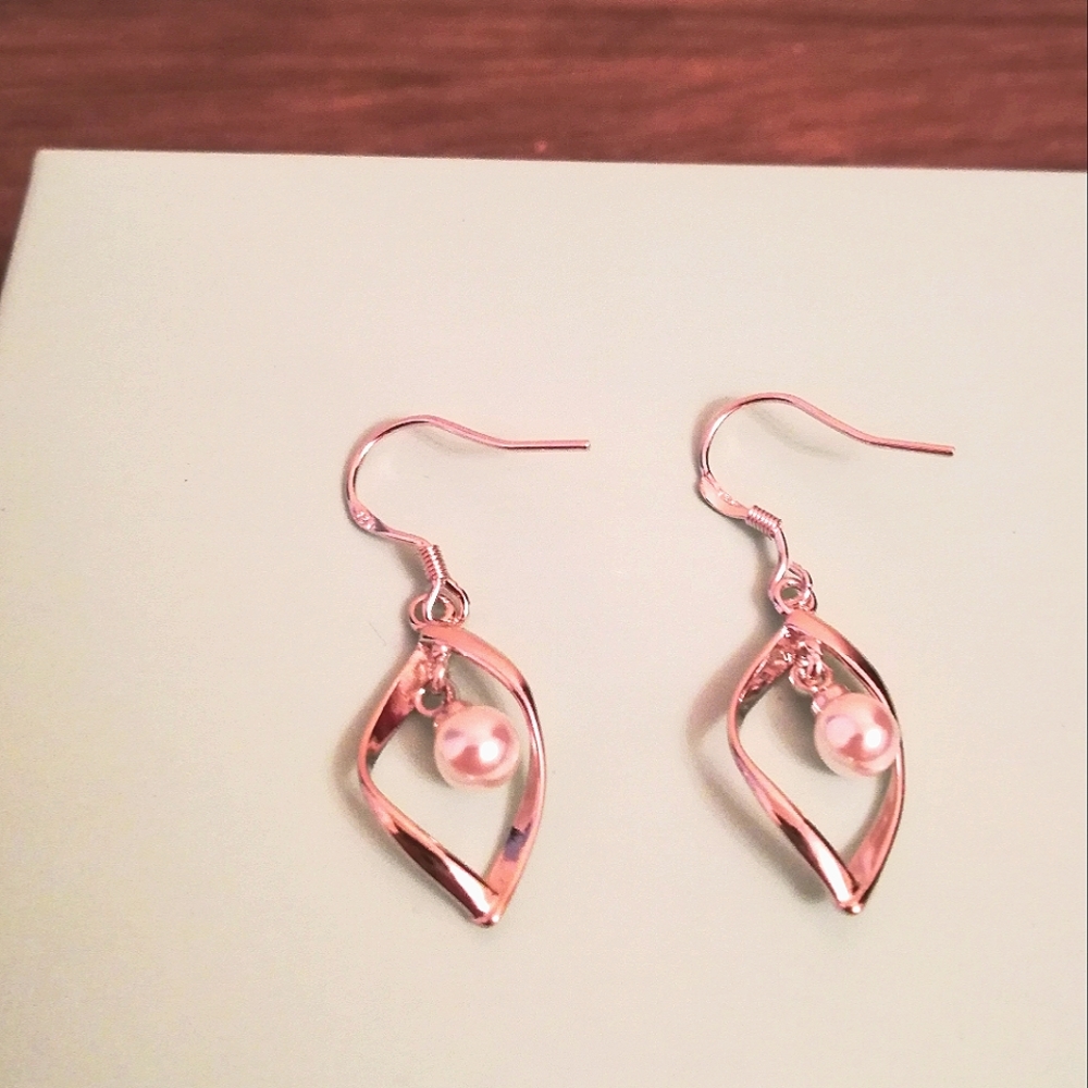 Silver And Pearl Dangle Earrings.